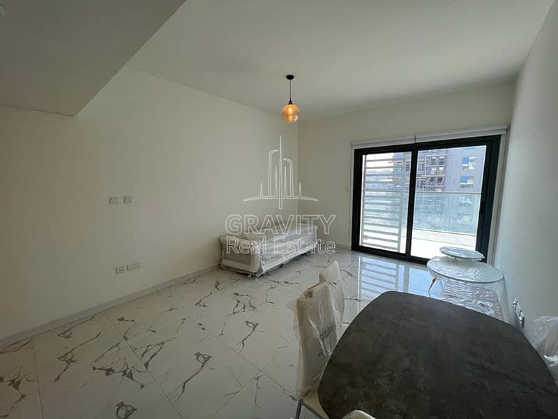5 spacious-living-hall-area-with-marble-tiling-in-2-bedroom-apartment-in-al-raha-lofts-2. jpg