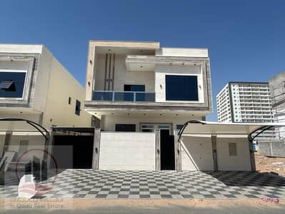 For sale, a villa in Ajman Al Helio, 5 master rooms, a Majles room, a hall, and a maids room, freehold for all nationalities, Installment with out do