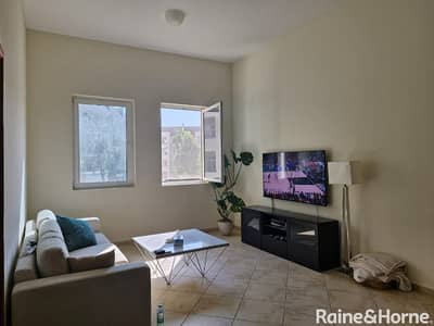 1 Bedroom Flat for Rent in Motor City, Dubai - Vacant- Ready to Move|1BR + Store room|Garden View