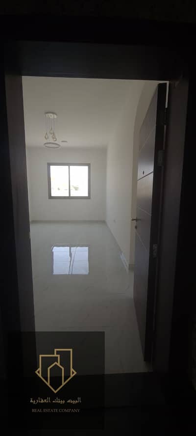 #For annual rent in Ajman, first resident in Al Rawda 2, close to all services, 2 studio, ground floor, large area   A room, a living room, and a larg