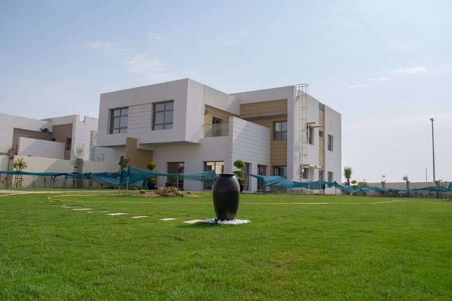 huge villa for sale in garden city between Sharjah and  Dubai foot price 279 AED best price in  UAE