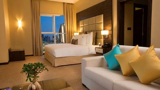 شقة فندقية  للايجار في منطقة النادي السياحي، أبوظبي - Deluxe Suite (1). jpg