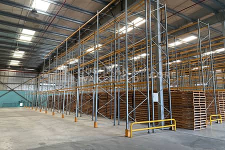Warehouse for Sale in Jebel Ali, Dubai - Fully Racked Logistics Facility | 11 Meter Eaves