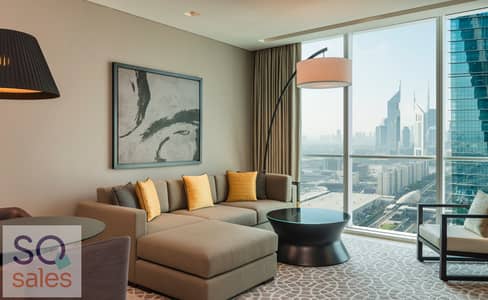 شقة فندقية 2 غرفة نوم للايجار في شارع الشيخ زايد، دبي - Sheraton Grand Hotel, Dubai - 1 and 2 Bedroom Living Room - Apartment - Copy - Copy - Copy. jpg