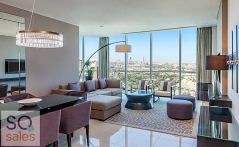 شقة فندقية 1 غرفة نوم للايجار في شارع الشيخ زايد، دبي - Sheraton Grand Hotel, Dubai - 3 Bed Apartment - Living Room City View - Copy. jpg