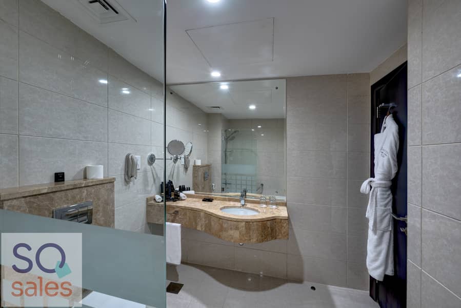5 Ghaya Grand Hotel Dubai  - One Bedroom Bathroom 4. jpg