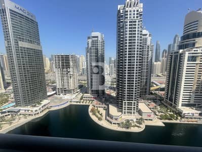 Office for Rent in Jumeirah Lake Towers (JLT), Dubai - HIGH FLOOR | PARTITIONED | CANAL VIEW