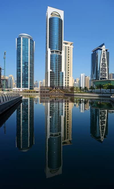 Studio for Rent in Jumeirah Lake Towers (JLT), Dubai - 141217_439_GOLD-CREST-EXECUTIVE-TOWER_VIEW-FROM-LAKE_zj. jpg
