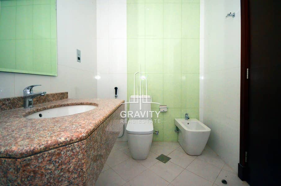 14 toilet-with-sink-and-green-and-white-wall-in-1-bedroom-apartment-in-hydra-avenue. JPG