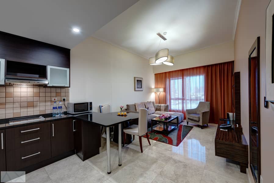 2 Ghaya Grand Hotel Dubai  - One Bedroom Living Room - Copy. jpg