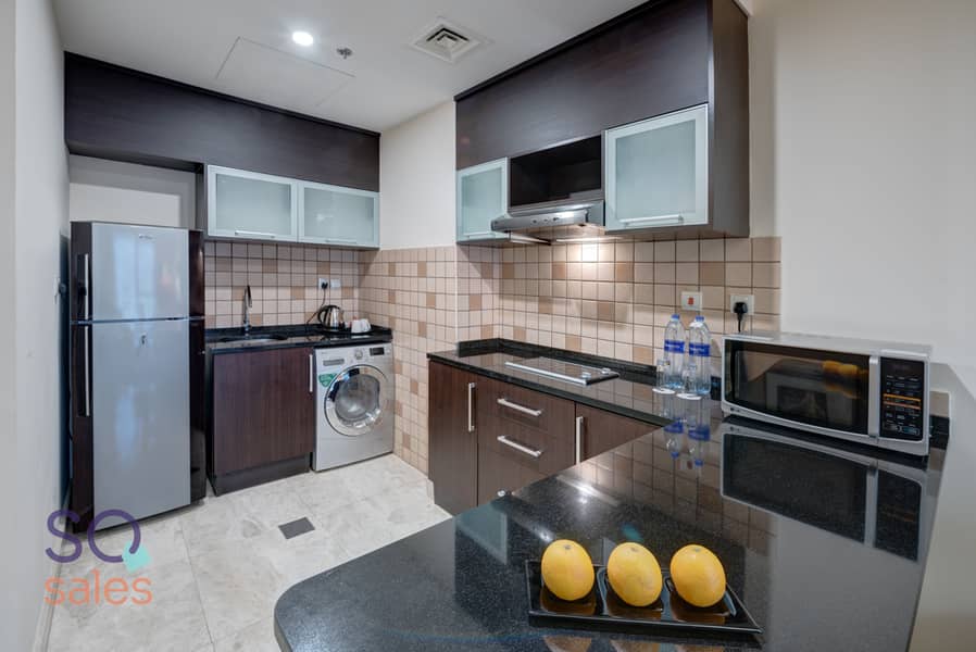 4 Ghaya Grand Hotel Dubai  - One Bedroom Kitchen. jpg