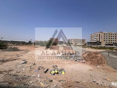 Ajman, Al Wodah 2, on an asphalt road between buildings. . . 