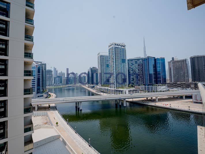 Modern 1BR | Burj + Canal View | Prime Location