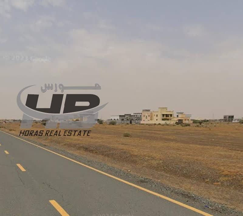 Land for sale in Al Manama, Ajman, 1000 square meters. Prime location