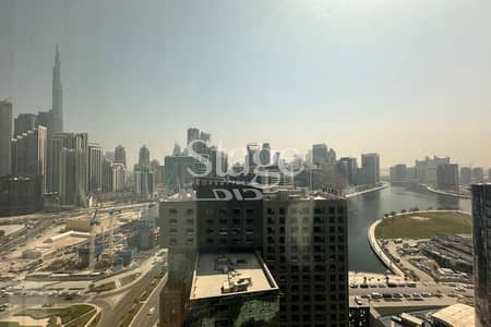 Office for Rent in Business Bay, Dubai - Burj Khalifa and Canal View | Ready to Move In