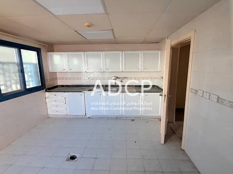 8 7133 @ Flat#2 (lower) kitchen with balcony (1). jpg