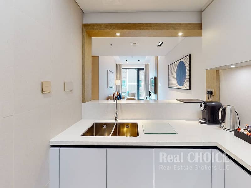 7 CMTP_Deluxe_One_Bedroom_Kitchen-view. jpg
