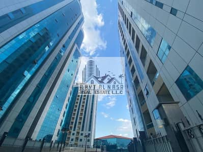 Spacious Two bedroom hall apartment with balcony covered car parking available for rent in orient tower ajman