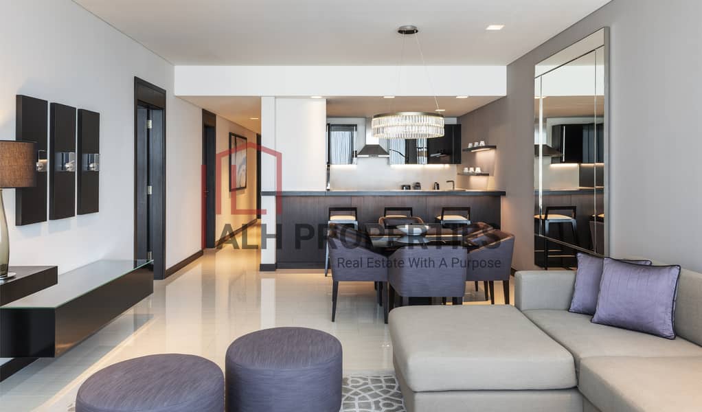 5 Sheraton Grand Hotel, Dubai - 3 Bedroom Apartment - Living Room. jpg