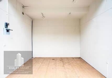 Shop for Rent in International City, Dubai - empty-modern-shop-photo (1). jpg