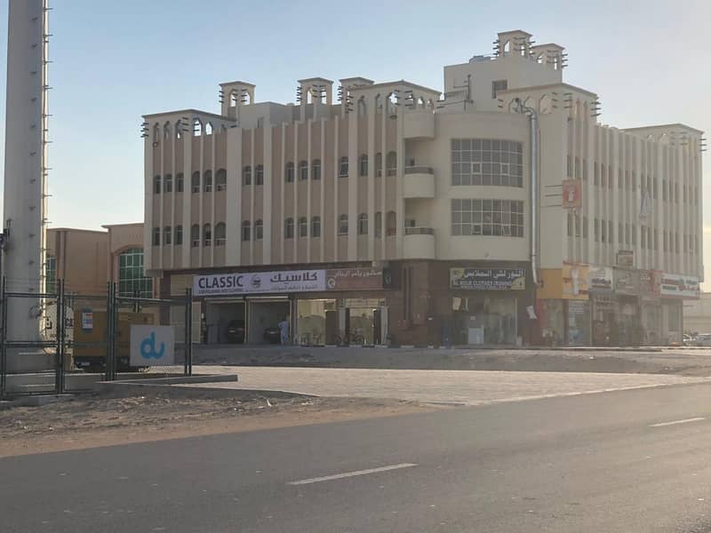 For sale building on the street commercial residential area vital location near the mosque