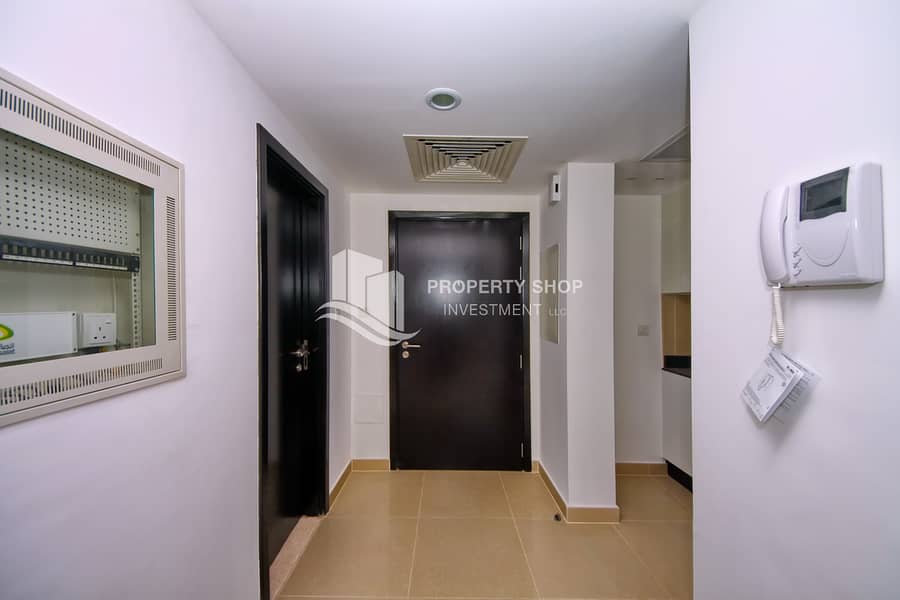 7 1-bedroom-apartment-abu-dhabi-al-reef-downtown-foyer. JPG