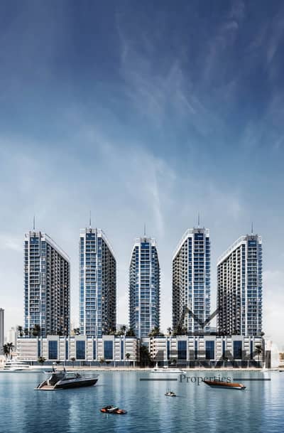 A luxurious apartment in Ajman with a full waterfront view, covering an area of 7.5.