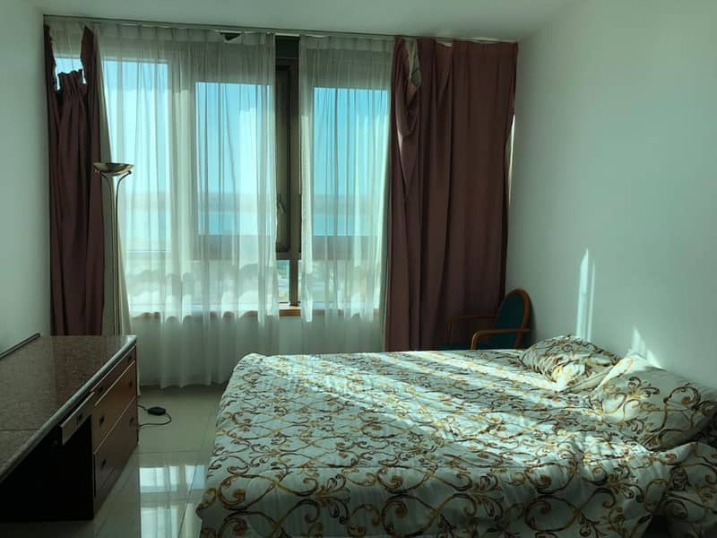 studio with furniture include electric and water sea view