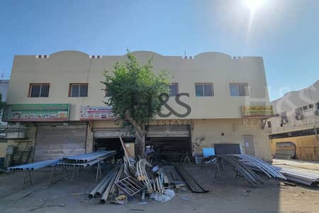 Building for Sale in Ajman Industrial, Ajman - Labor camp 32 rooms + 4 shops | Freehold | Investor Deal