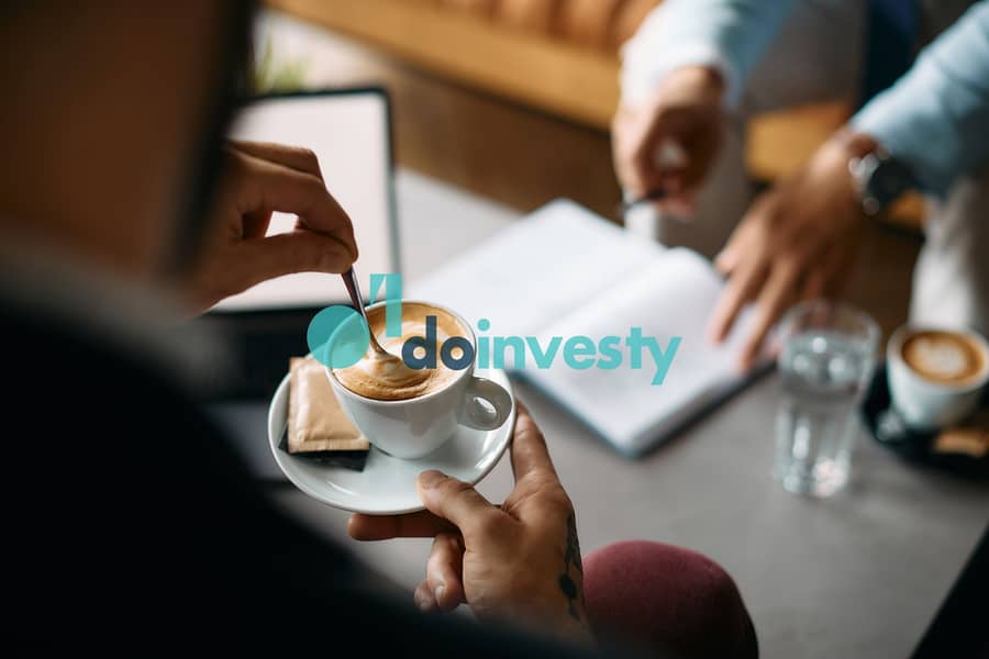 2 close-up-of-businessman-drinking-coffee-during-mee-2022-11-23-17-56-37-utc. jpg