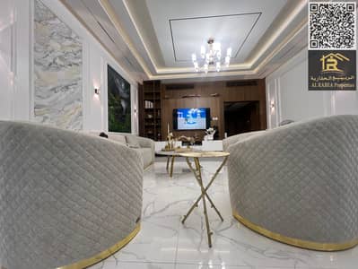 Three rooms and a hall with a maid's room with hotel furniture in the center of Ajman