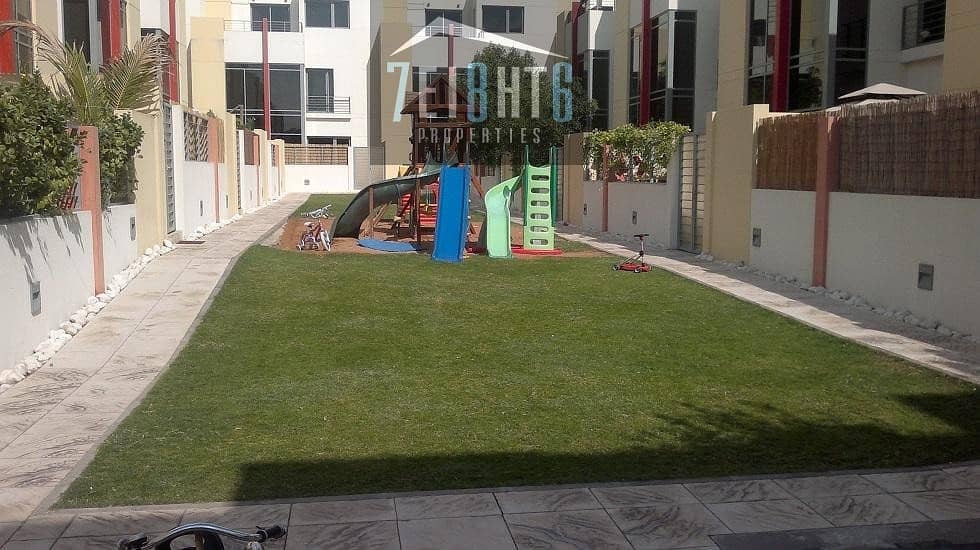 8 4 b/r semi-independent villa with maids room + gym + shared s/pool + landscaped garden + security for rent in Mirdif