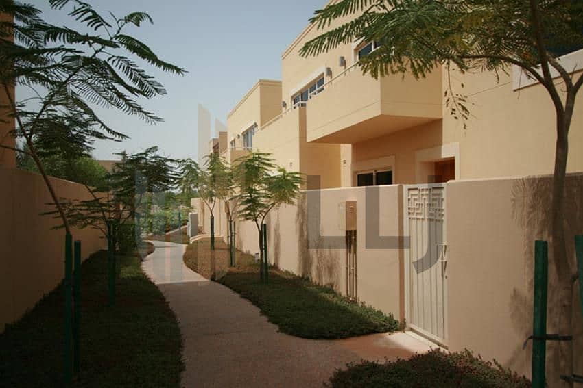 4 Actual-h7Q4hpFilV8Nt4kcx3y0B015al_raha_gardens_landscaped_walkway_in_between_residents. jpg