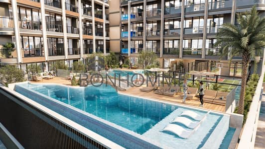 فلیٹ 1 غرفة نوم للبيع في قرية جميرا الدائرية، دبي - Pool - 105 Residences by Kamdar . jpg