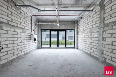 Shop for Rent in Meydan City, Dubai - Facing the road | Chiller free | Shell & core