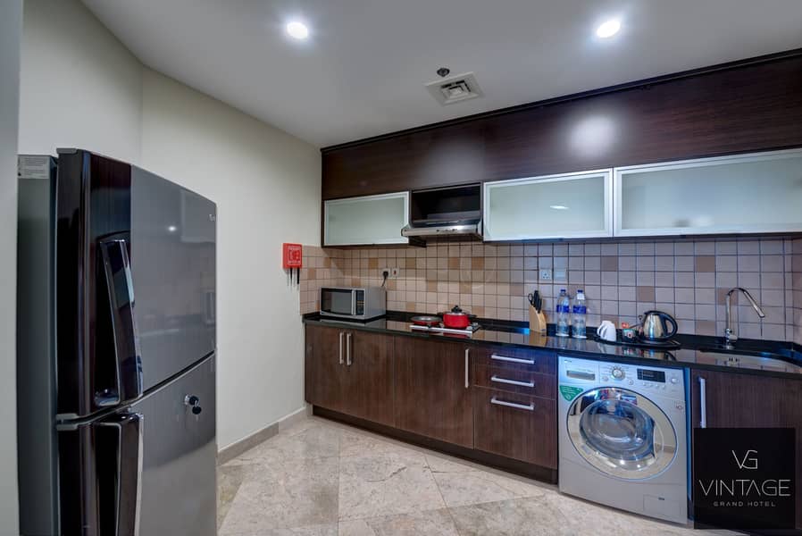 5 Ghaya Grand Hotel Dubai- Studio kitchen. jpg