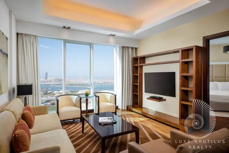 1 Bedroom Flat for Rent in Al Sufouh, Dubai - Deluxe One Bedroom Sea View Apartment_Living Room. jpg