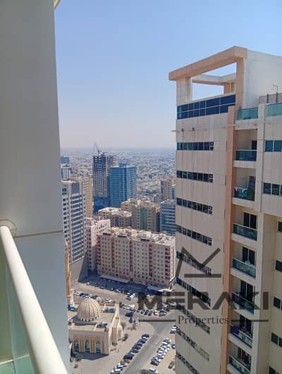 Two-bedroom apartment with a living room, overlooking Sharjah, ready for residence and investment.