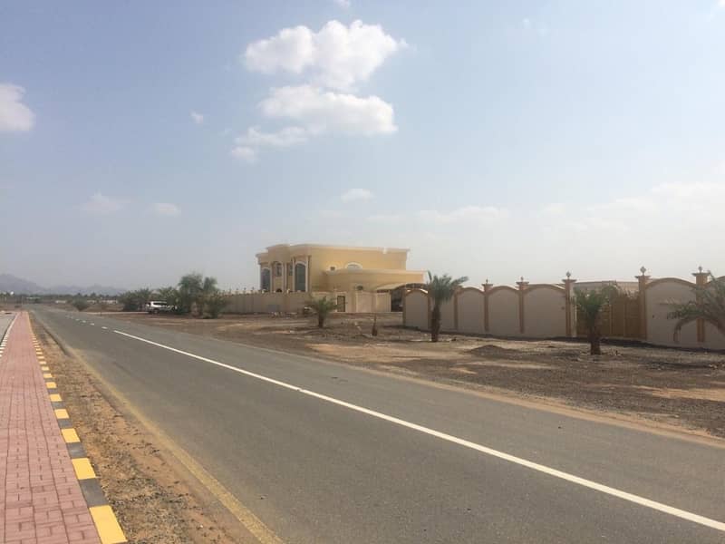 limited plots , only 3 plots direct on main road in manama area only 230k.