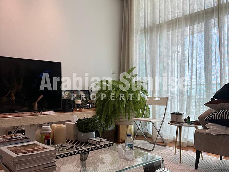 2 Beach-Towers-A-1BR-Maids-1904-Living. jpg
