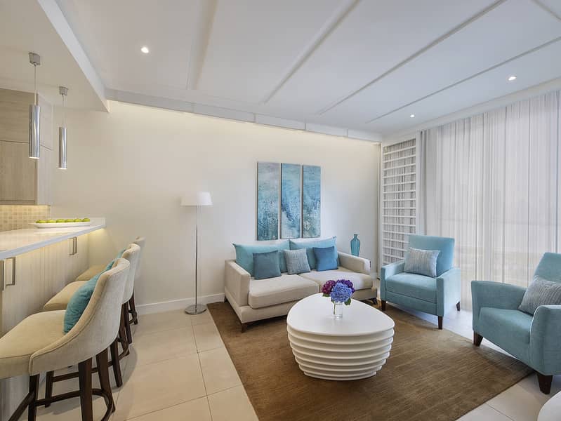 5 NH_Collection_Dubai_The_Palm_One_Bedroom_Apartment_Living_Area. jpg
