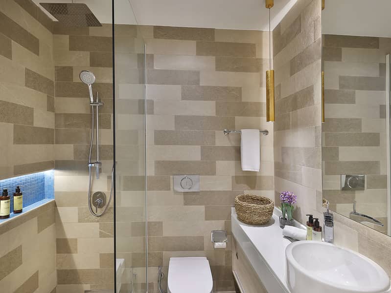 7 NH_Collection_Dubai_The_Palm_One_Bedroom_Apartment_Bathroom. jpeg
