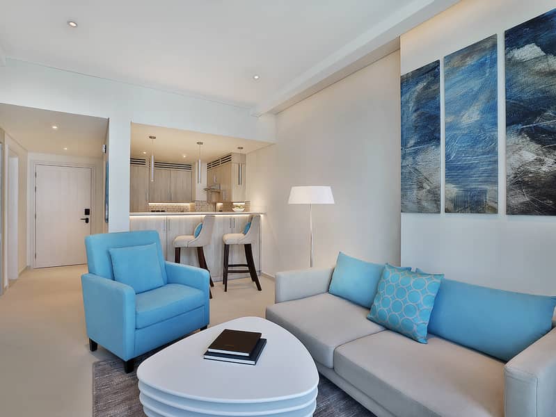 3 NH_Collection_Dubai_The_Palm_Superior_One_Bedroom_Apartment_Living_Area_2. jpg