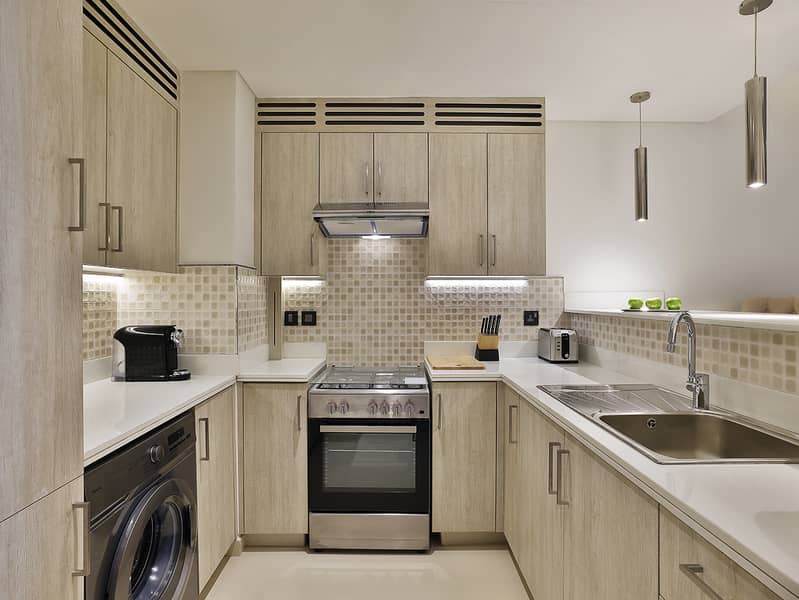 5 NH_Collection_Dubai_The_Palm_Superior_One_Bedroom_Apartment_Kitchen. jpg