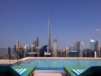 1 Bedroom Apartment for Rent in Business Bay, Dubai - Pool 2. jpg