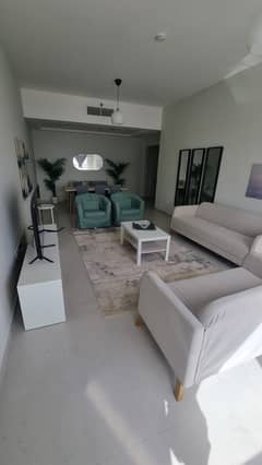 The most beautiful two-room apartment with a furnished view, free air conditioning, free parking, a gym, and a swimming pool.