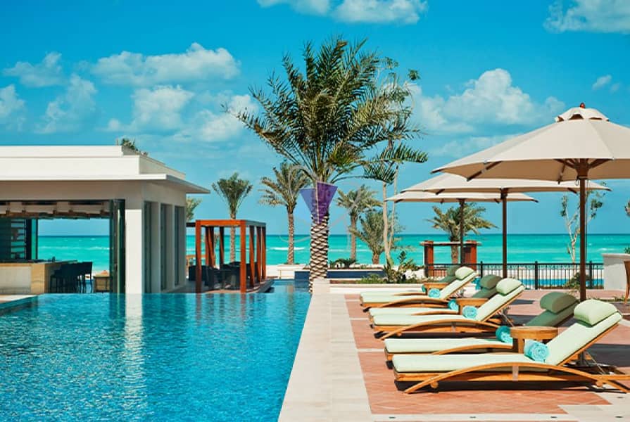 3 AbuDhabiSecrets-PoolLoungers-CreditStRegisSaadiyatIslandResort. jpg