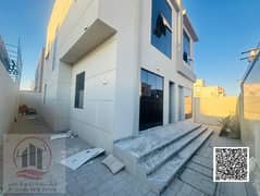 Villa for sale in Ajman, Al Yasmeen area, 4 master bedrooms, a living room, a hall, and a maid's room. Freehold for all nationalities, with the possib