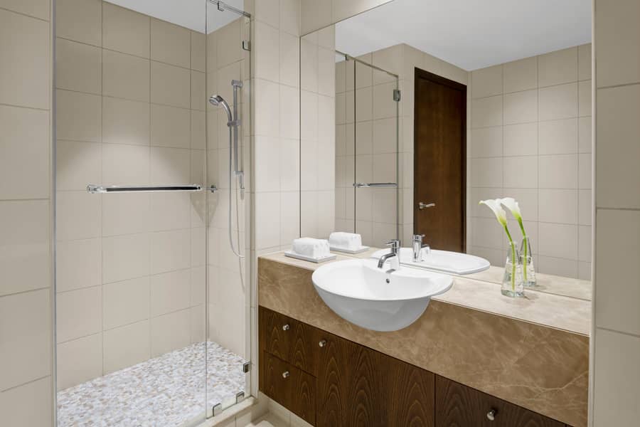 6 Two Bedroom Residence Suite with Creek and Urban View - Master Bathroom. JPG