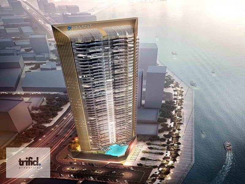 12 6503e67f3ca1f939ee9f796e_DXB MARITIME-SG_TOWER-Aerial_Dusk2-Opt3b (1). jpg